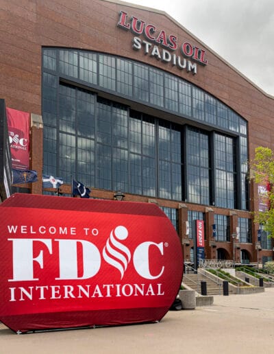 Outside Lucas Stadium with FDIC sign.