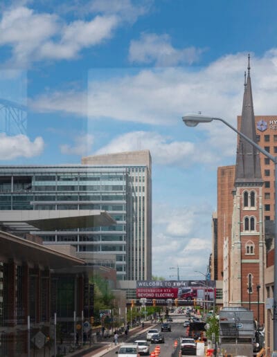 Street view in front of Convention Center with FDIC sign over road.
